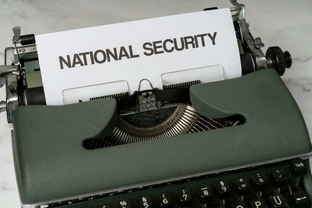 green and white typewriter on white table